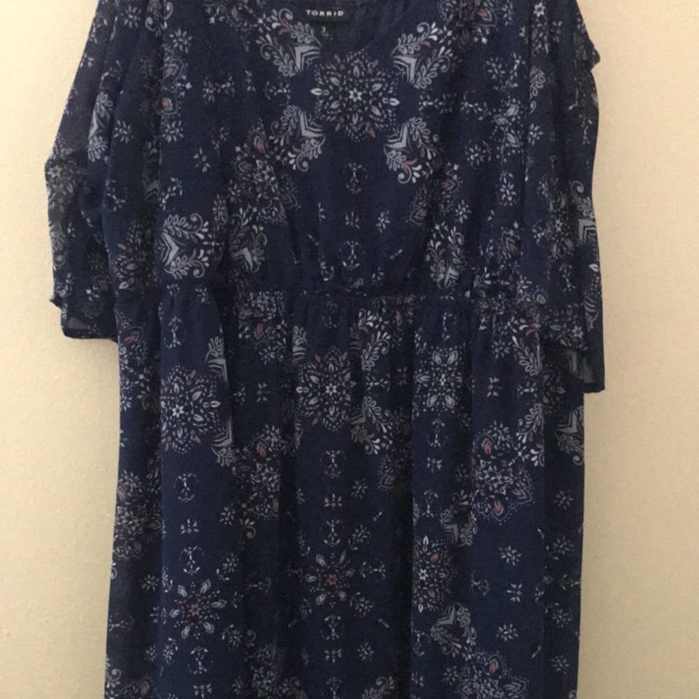 floral navy blue dress and a black tank top.